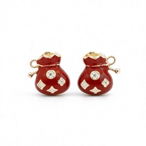 Exquisite red enamel lucky bag stud earrings with gold trim and sparkling zircon accents
