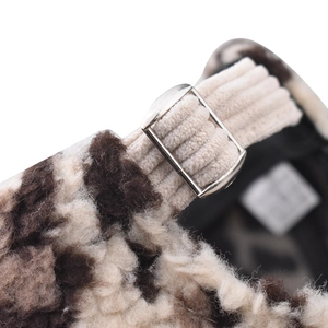 Detail of leopard print fleece baseball cap with corduroy strap and metal buckle