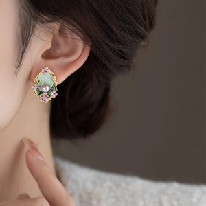 French vintage pearl floral stud earrings with gold plating worn by model