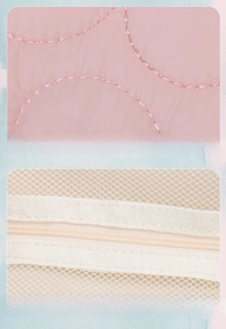 Close-up of pink quilted fabric texture with fine stitching and mesh lining detail