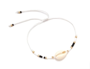 Detail of adjustable woven cord bracelet with natural shell and evil eye beads