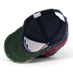 Detail of vintage distressed baseball cap showing 100% cotton label and metal buckle