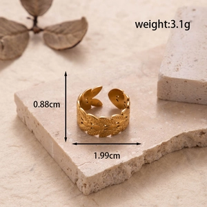 Adjustable golden stainless steel ring featuring minimalist hollow leaf pattern