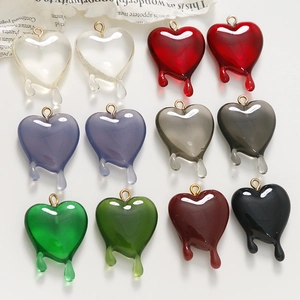 Colorful translucent melting heart pendants with gold rings in seven vibrant shades