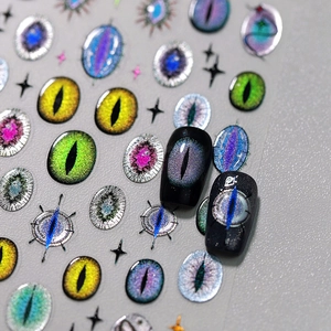 Dark fantasy evil eye nail art stickers with 3D iris textures on black manicure