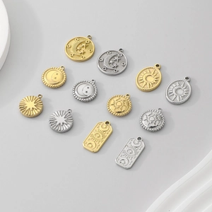 Set of gold and silver celestial pendants with sun, moon, and star charms in stainless steel