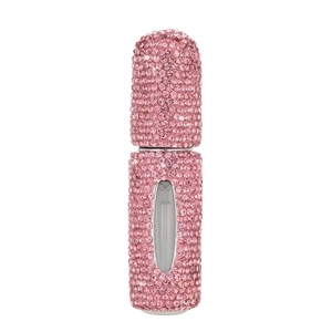 Portable refillable perfume bottle with pink rhinestones and a clear level window