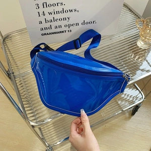 Transparent bright blue PVC waist bag with nylon strap on a metal grid background