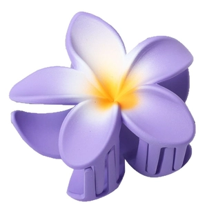 Purple plumeria hair claw clip for summer beach styling with a matte floral finish
