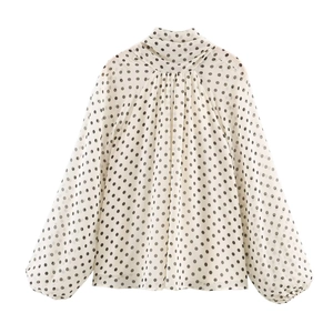 Elegant polka dot chiffon blouse featuring high pleated neck and lantern sleeves