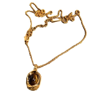 Gold-plated necklace featuring an oval tiger eye stone pendant on a twisted rope chain