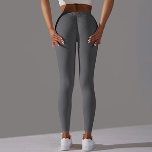 Close-up of high-waist scrunch butt design on dark gray yoga leggings with v-waist contour