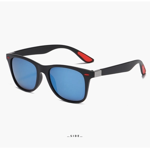 Side view of matte black sport sunglasses with blue mirrored lenses and red accents