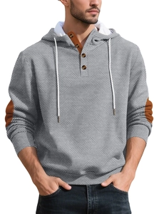Detail of grey men's hoodie featuring geometric knit texture and a buttoned placket