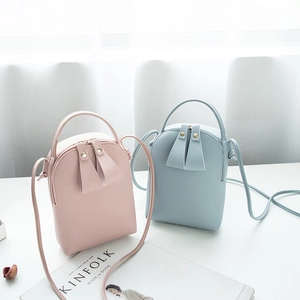 Mini synthetic leather crossbody bags in pink and light blue with metallic zippers
