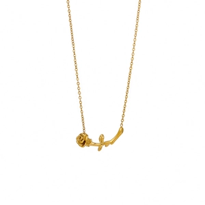 Elegant gold rose necklace with a horizontal flower branch pendant on a white background