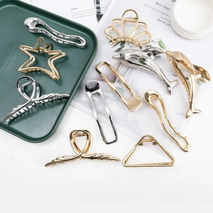 Elegant gold and silver metal hair claws in geometric and dolphin shapes for women