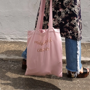 Pink satin tote bag with gold midnight circus embroidery detail for daily fashion