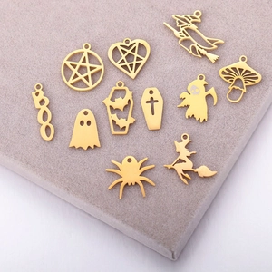 Selection of golden stainless steel Halloween pendants including witch and ghost charms
