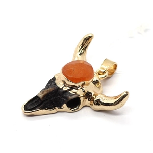 Golden resin bull skull pendant with orange gemstone inlay and dark stone texture
