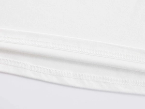 Detailed close-up of double-needle stitching and fine knit texture on white T-shirt hem