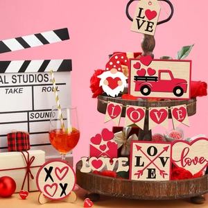 Close-up of tiered tray Valentine wood decor with red gnome, love truck and XOXO signs