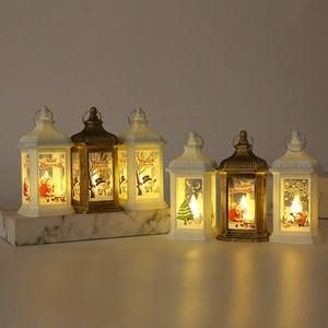 Detail view of festive LED lanterns with Christmas illustrations in white and bronze finishes