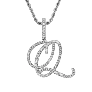 Macro detail of silver iced-out cursive letter Q pendant with rope chain necklace