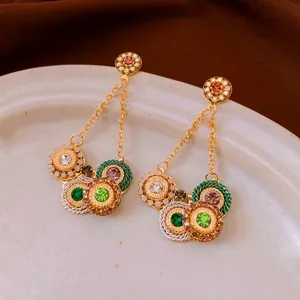 Bohemian crystal fringe drop earrings with colorful gems on a vintage gold metal base