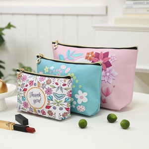 Three-piece set of floral waterproof PU makeup bags in white, blue, and pink colors