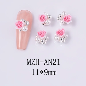Macro detail of 3D pink rose nail charms with pearls and silver beads, 11x9mm size