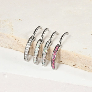 Curved stainless steel belly rings with opal and cubic zirconia in four distinct colors