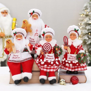 Detail of Christmas chef figurines with Merry Christmas embroidery on book stands