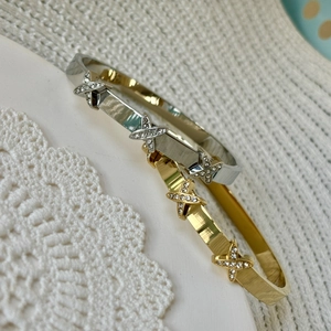 Crossed X design titanium steel bangles with sparkling crystals and brushed finish