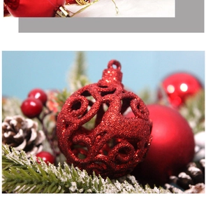 Detailed view of red hollow Christmas ball featuring reindeer pattern and glitter finish