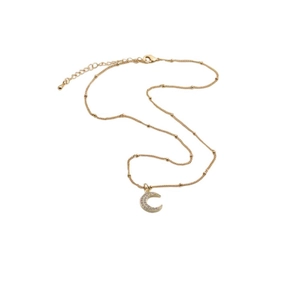 Detail of gold crescent moon pendant necklace with clear zircon stones on fine bead chain