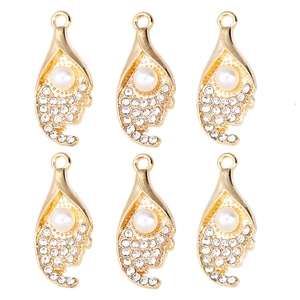 Elegant gold alloy pendant with white pearl and sparkling zircons on white background