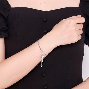 Minimalist silver heart lock and key titanium steel adjustable bracelet on model