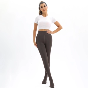Close-up of high-waist thermal leggings with seamless fit and slimming effect in dark charcoal