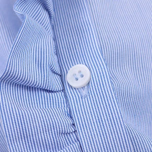 Close-up of blue and white striped poplin shirt showing fine fabric and white button