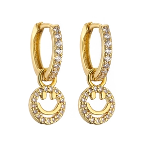 Detail of gold huggie earrings with smiling face pendants and sparkling crystals