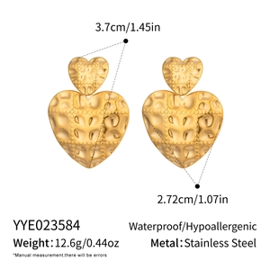 Detailed view of gold textured heart earrings with dimensions 3.7cm and weight 12.6g