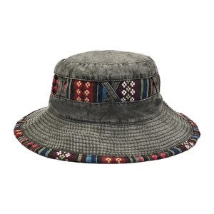 Detailed view of dark grey bucket hat with ethnic woven band and vintage wash texture