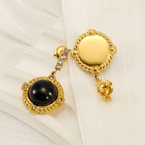 Vintage gold titanium earrings with black stone, twisted rope border, and white crystals