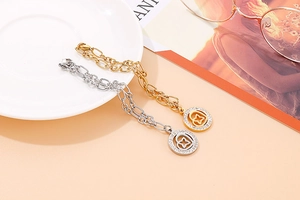 Close-up of gold and silver heart star pendant bracelets with rhinestone detailing