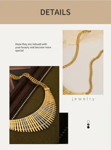 Macro detail of gold plated fence style bib necklace with sparkling zircon inlay
