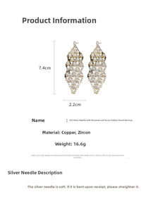 Detail view of hollow tassel earrings with white zircon, dimensions 7.4cm by 2.2cm