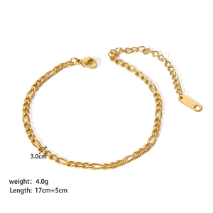 Macro detail of gold Figaro chain bracelet in stainless steel with 17cm plus 5cm length