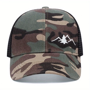 Close-up of mountain and pine embroidery on breathable camouflage mesh trucker hat