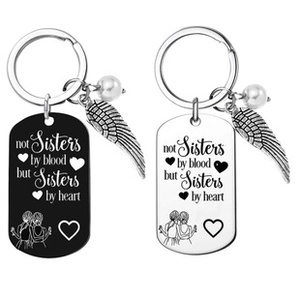 Detail of engraved stainless steel friendship keychains with silver and black finish